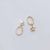 Boucles d'oreilles pendantes à coquille creuse elliptiques asymétriques avec étoile CZ Star en argent sterling 925